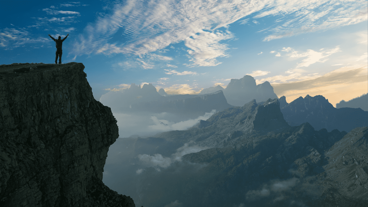 Man at the top of mountain