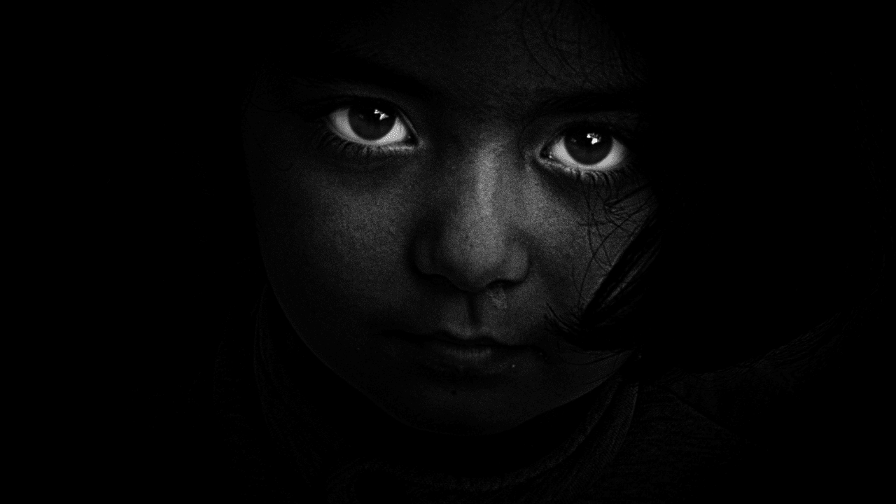 Dark image of sad child